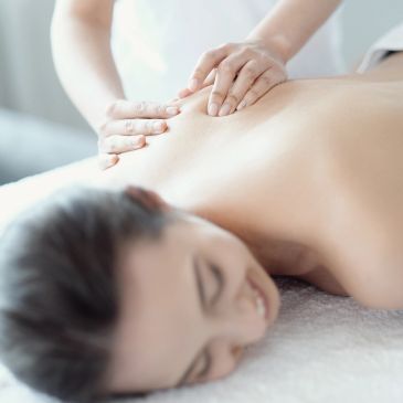Woman receiving a back massage.