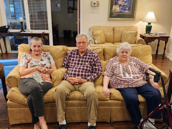 Residents socializing during an activity at Pine Needle Senior Living