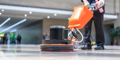 Worker Spray Buffing Floor