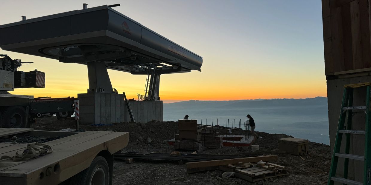 Sunset view from the top of a mountain getting ready to pour concrete for a ski lift base.