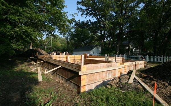 wooden building in backyard being constructed