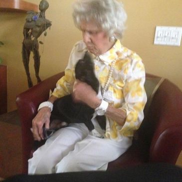 an elderly woman with a dog