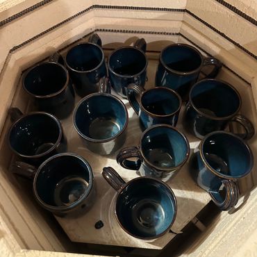 Mugs in kiln.