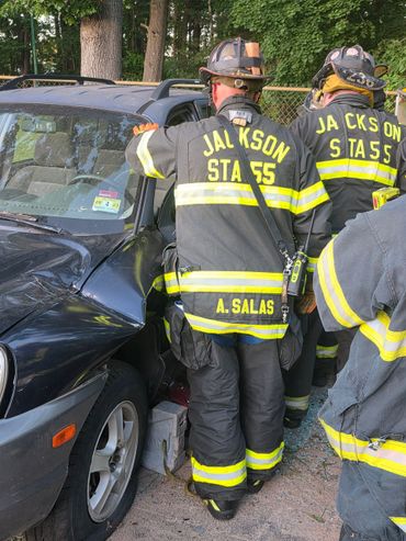 Firefighters from Jackson Station 55 working at a car accident scene.