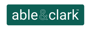 Logo of the brand 'able &amp; clark' on a green rectangular background.