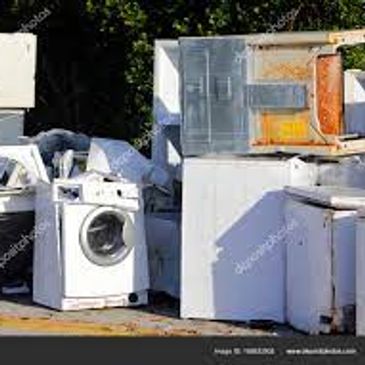 old broken washer and dryer and refrigerators