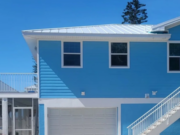 Roofing services by ICAS Storm Restoration FL with a durable metal roof installation.