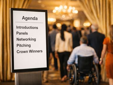 Signboard displays event agenda with people entering venue.