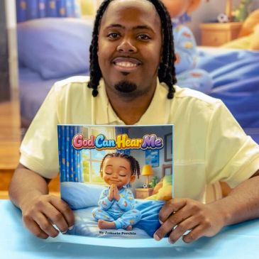 Man holding a children's book titled 'God Can Hear Me'.