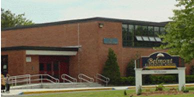 Building with Belmont sign in front.