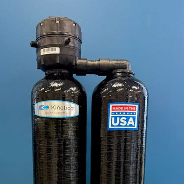 Kinetico dual tank non-electric water softener with Made In THE USA label.