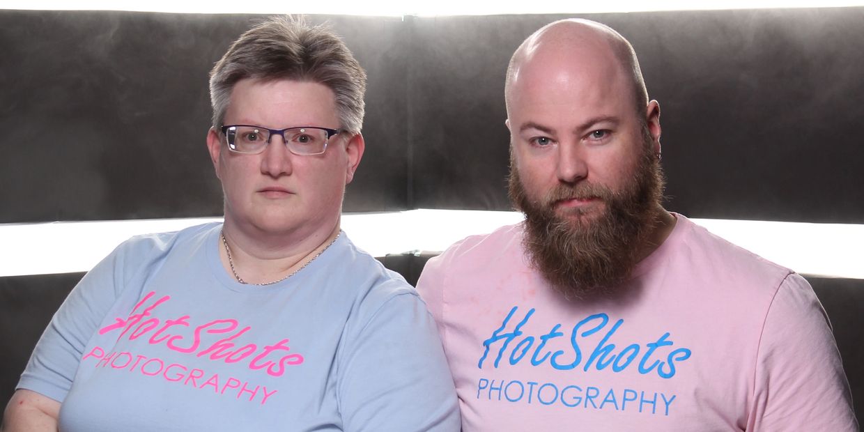 Brandie and Michael posing with a DIY altered v-flat background