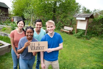 Group of four smiling volunteers
