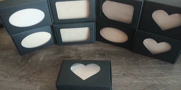 Handmade boutique bar soap in black boxes with a clear window