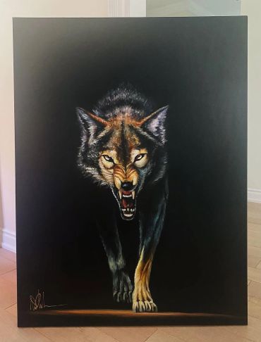 A fierce wolf walking forward against a dark background.