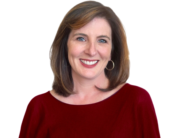 Smiling woman with shoulder-length hair in a red top and hoop earrings.