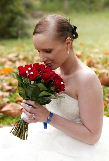 Bride smelling roses 