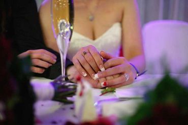 Wedding couple holding hands