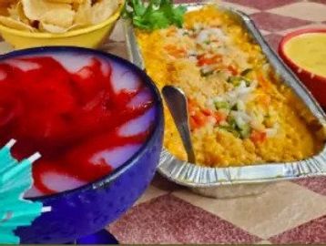 Some different varieties of food on a table with a red dish