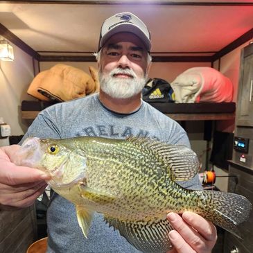 angler holding a crappie
