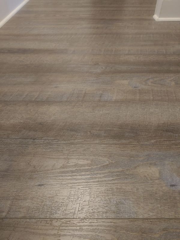 Post scrubbing and cleaning of vinyl plank floor.