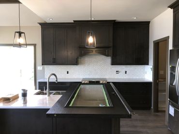 Modern kitchen with white backsplash tile.
