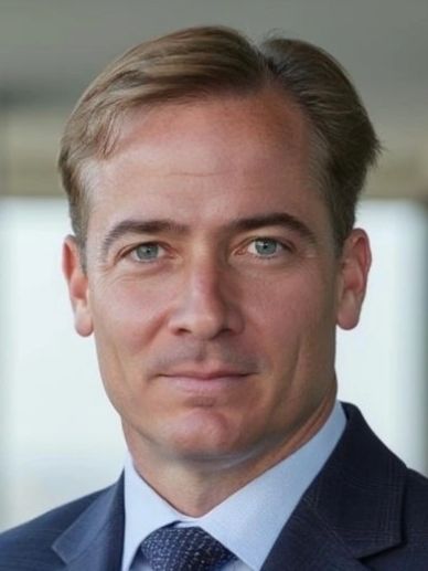 Professional man in a suit and tie with a confident expression.
