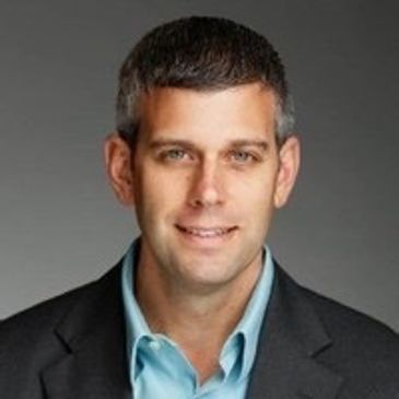 Professional business man with grey suit and blue collared shirt