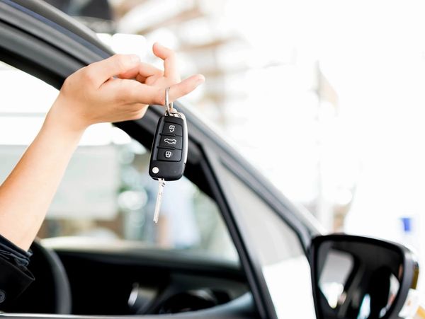 Woman holding car keys.