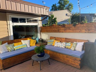 Built in storage benches with custom cushions we did for this small patio.