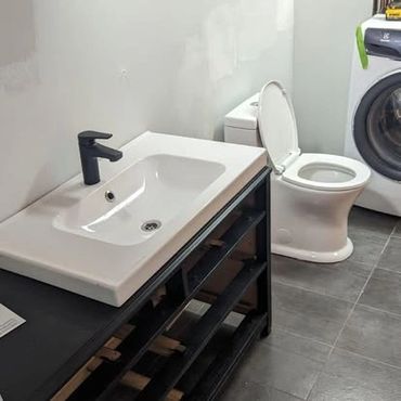 Installing an old dresser with a modern sink.
