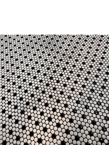 Penny tiled flooring to keep with the era of the 1960's home. 