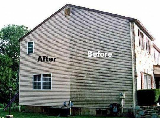 Before-and-after siding wash showing dark buildup removed from a house wall.