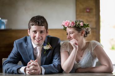 Flower crown with pink spray roses and white wax flower. 