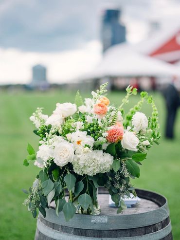 Flower arrangement in white, peach, blush and green. 