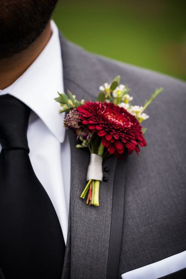 Burgundy gerbera pom boutonniere 