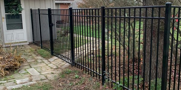 Ornamental aluminum fence with a gate