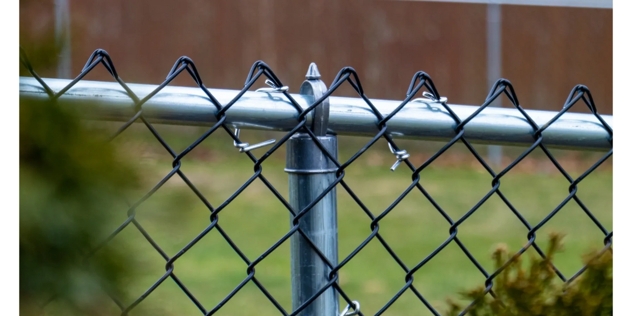 Black Chain Link Fence tied to a top rail, post, and fence loop.  Installed in Munroe Falls, Ohio