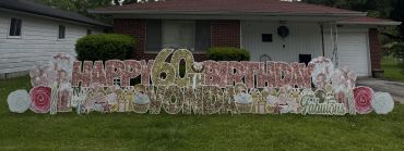 Outdoor birthday sign saying Happy 60th Birthday Elizabeth Brunswick.