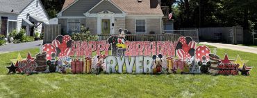 Mickey Mouse-themed birthday yard sign decoration.