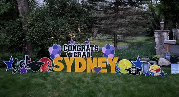 Congrats Grad cutout sign with fun accessories in Indianapolis.