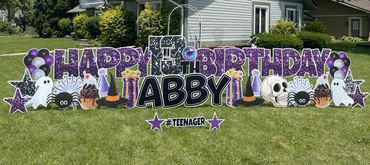 Purple sparkle and black happy birthday yard sign Greenwood Indiana with halloween items