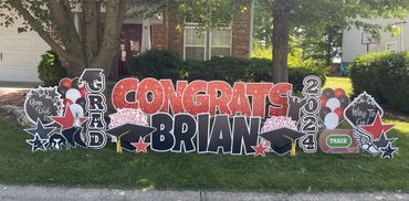 Red sparkle congrats graduation yard sign display in Speedway Indianapolis Indiana