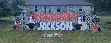 Red sparkle graduation yard sign Southport Indiana and New Palestine High School colors.
