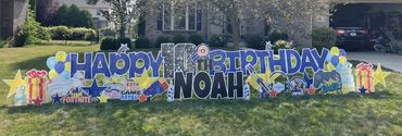 Blue Happy Birthday Yard Sign with Nerf Guns in Indianapolis and Greenwood
