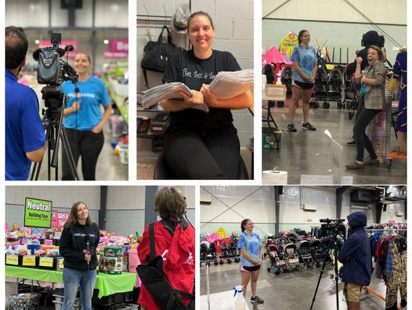 Woman being interviewed at an indoor event with various kids' items.