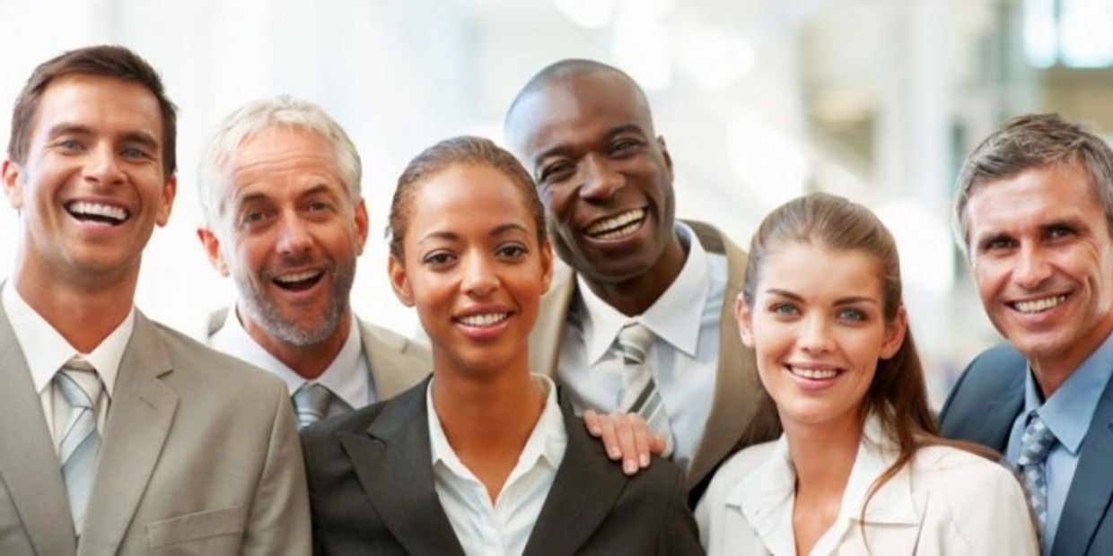 A group of people men and woman in business attire.