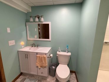 Small bathroom with sink and toilet.