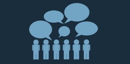 Stock image of people figures with speaking bubbles above heads.