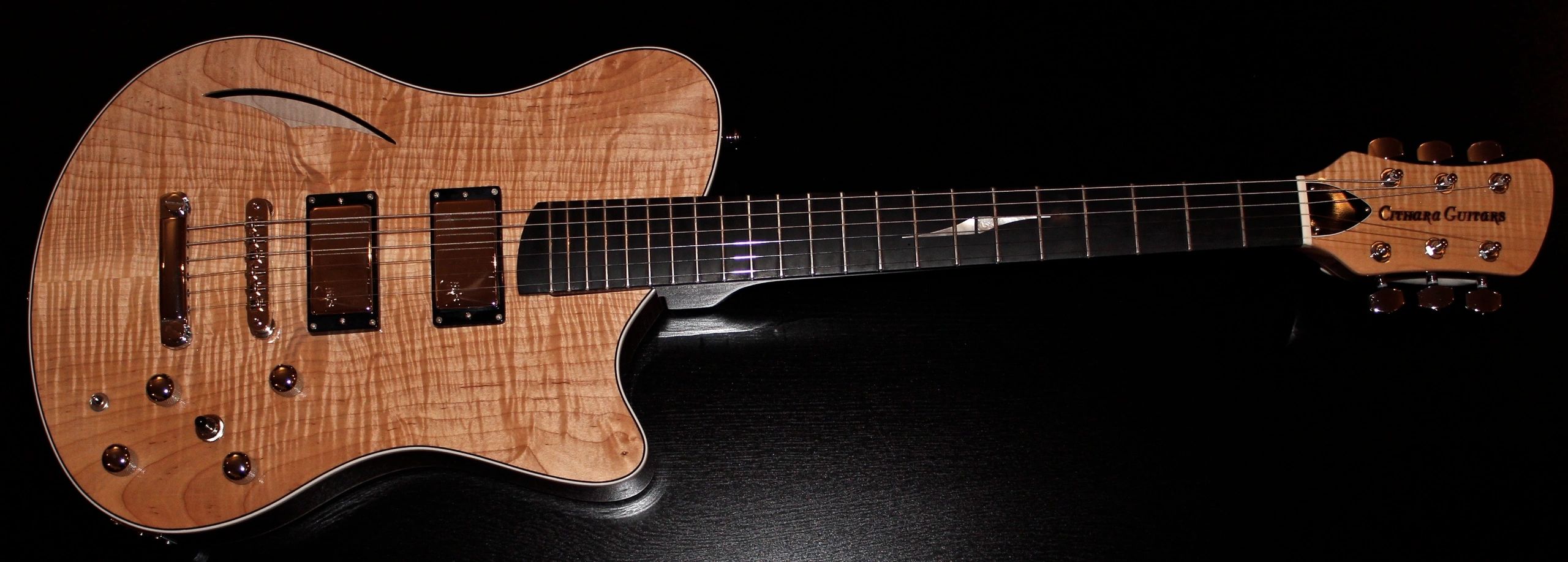 Mike Dibari's hollow-body with rear-centre block Cithara electric guitar.